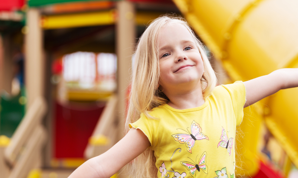 young blonde girl at the park