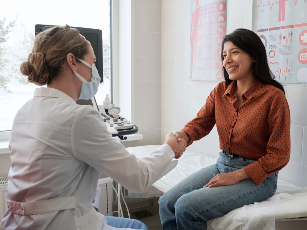 female clinician with hispanic female patient