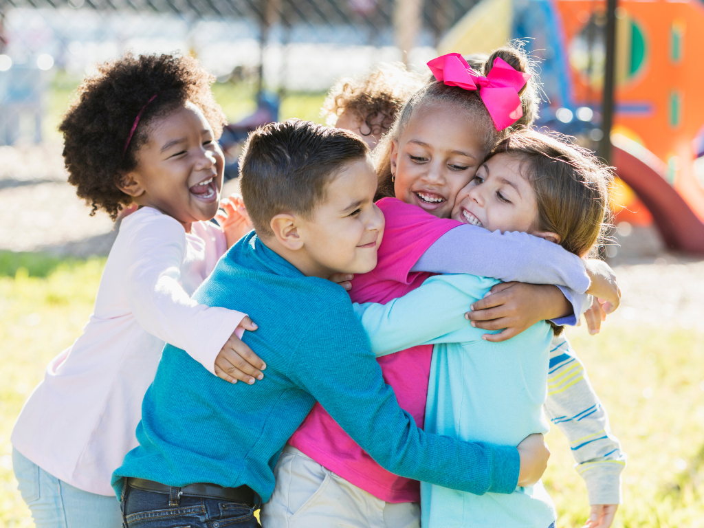 happy children hugging and playing